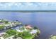 Aerial view of waterfront community with waterfront homes and canal access to the river at 12438 Prather Ave, Port Charlotte, FL 33981