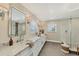 Bright bathroom featuring dual sinks, marble countertops, and a spacious glass-enclosed shower with stylish tile at 12438 Prather Ave, Port Charlotte, FL 33981