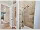 Clean and updated bathroom shower with decorative tile work and bronze fixtures at 12438 Prather Ave, Port Charlotte, FL 33981