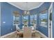 Breakfast nook with a glass table and water views from every window at 12438 Prather Ave, Port Charlotte, FL 33981