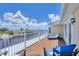 View of the outdoor deck area featuring stylish patio furniture and a gorgeous water view at 12438 Prather Ave, Port Charlotte, FL 33981