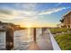 View of the sunset along the waterfront dock and canal at 12438 Prather Ave, Port Charlotte, FL 33981
