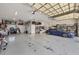Spacious garage with room for multiple cars, storage racks, bikes, and great lighting at 12438 Prather Ave, Port Charlotte, FL 33981