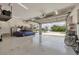 Spacious garage with room for multiple cars, storage racks and well lit at 12438 Prather Ave, Port Charlotte, FL 33981