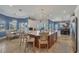 Bright kitchen with a large island, seating, tile flooring, and a dining area with water views at 12438 Prather Ave, Port Charlotte, FL 33981