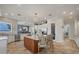 The kitchen has a center island with seating, and views into the dining room at 12438 Prather Ave, Port Charlotte, FL 33981