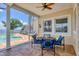 The patio features ample seating and a ceiling fan, creating an ideal space for relaxation and outdoor enjoyment at 12438 Prather Ave, Port Charlotte, FL 33981