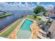 Overhead view of pool in fenced-in yard overlooking river, perfect for entertaining at 12438 Prather Ave, Port Charlotte, FL 33981