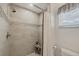 Bright shower with large tiles and curtain at 12438 Prather Ave, Port Charlotte, FL 33981