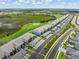 Panoramic aerial view of the condos, golf course, ponds, green spaces, and wetlands at 12550 Galapagos Ct # 104, Venice, FL 34293
