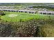 Great aerial view of the golf course, ponds, green spaces, and condo development at 12550 Galapagos Ct # 104, Venice, FL 34293
