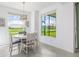Cozy dining area with golf course views at 12550 Galapagos Ct # 104, Venice, FL 34293