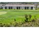 Scenic view of the well-manicured golf course and beautiful landscaping surrounding the condos at 12550 Galapagos Ct # 104, Venice, FL 34293