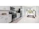 Bright kitchen featuring stainless appliances and white countertops at 12550 Galapagos Ct # 104, Venice, FL 34293