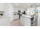 Modern kitchen with white cabinets and stainless steel appliances at 12550 Galapagos Ct # 104, Venice, FL 34293