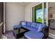 Comfortable screened-in patio with outdoor seating and golf course view at 12550 Galapagos Ct # 104, Venice, FL 34293
