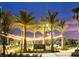 Evening image of the downtown area in Wellen Park with lighted trees and benches at 12550 Galapagos Ct # 104, Venice, FL 34293