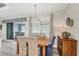 Cozy dining area with hardwood table and chairs adjacent to covered patio at 1269 N Lavina St, North Port, FL 34286