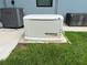 Image shows a Generac generator, ensuring continuous power, placed next to an Amanda HVAC unit and black deck box at 1269 N Lavina St, North Port, FL 34286