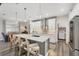 Stylish kitchen with a large island, pendant lighting, and modern appliances at 1269 N Lavina St, North Port, FL 34286