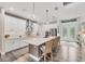 Modern kitchen with a large island, pendant lights, and a full suite of stainless appliances at 1269 N Lavina St, North Port, FL 34286