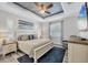 Comfortable main bedroom featuring a ceiling fan and plantation shutters at 1269 N Lavina St, North Port, FL 34286