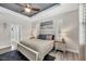 Comfortable main bedroom featuring a ceiling fan and plantation shutters at 1269 N Lavina St, North Port, FL 34286