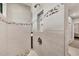 Modern walk-in shower with decorative tile and niche at 1269 N Lavina St, North Port, FL 34286