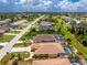 Single-Gathering home aerial view, showcasing the spacious layout, in-ground pool, and lush landscaping within property lines at 127 Jennifer Dr, Rotonda West, FL 33947