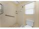 Accessible bathroom features tiled walk-in shower and safety grab bars at 127 Jennifer Dr, Rotonda West, FL 33947