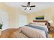 Spacious bedroom featuring hardwood floors, a ceiling fan, and natural light at 127 Jennifer Dr, Rotonda West, FL 33947