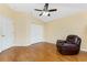 Bedroom featuring wood floors, ceiling fan, and a double-door closet at 127 Jennifer Dr, Rotonda West, FL 33947