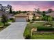 Charming home featuring a well-manicured lawn, neutral paint, and a two-car garage at 127 Jennifer Dr, Rotonda West, FL 33947
