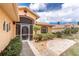 Charming home exterior featuring a decorative front door, well-manicured landscaping, and a cozy screened porch for curb appeal at 127 Jennifer Dr, Rotonda West, FL 33947