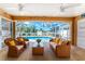 Screened lanai overlooking the backyard pool offering shade and a relaxing atmosphere at 127 Jennifer Dr, Rotonda West, FL 33947