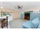 Living room with a breakfast bar, view of the pool area, and a wall-mounted TV at 127 Jennifer Dr, Rotonda West, FL 33947