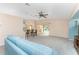 Open living area with a breakfast bar overlooking the kitchen and a large sliding glass door leading to the pool at 127 Jennifer Dr, Rotonda West, FL 33947