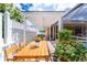 Outdoor dining area with a pergola providing shade, ideal for gatherings at 127 Jennifer Dr, Rotonda West, FL 33947