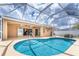 Beautiful pool surrounded by a screened lanai, perfect for outdoor entertaining at 127 Jennifer Dr, Rotonda West, FL 33947