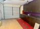 Garage with storage cabinets, ample space for parking and extra storage at 133 Paddington Rd, Venice, FL 34293