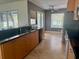 Spacious kitchen with granite countertops, stainless appliances and views to pool at 133 Paddington Rd, Venice, FL 34293
