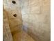 Shower with a decorative accent tile border and a bronze shower head fixture at 133 Paddington Rd, Venice, FL 34293