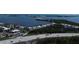 Aerial view showcasing the surrounding area, including a road and nearby waterways at 1401 S Mccall Rd # 101, Englewood, FL 34223