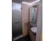 Sleek bathroom with a glass-enclosed shower, granite countertop, and contemporary fixtures at 1401 S Mccall Rd # 101, Englewood, FL 34223