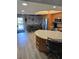 Bright kitchen with wood cabinets, stainless steel appliances, and breakfast bar with seating at 1401 S Mccall Rd # 101, Englewood, FL 34223