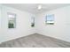 This bedroom features neutral walls and wood-look flooring with lots of natural light at 15 Bunker Pl, Rotonda West, FL 33947
