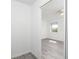 This spacious bedroom has a ceiling fan, large windows, and a large closet at 15 Bunker Pl, Rotonda West, FL 33947