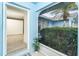 Inviting entryway featuring a view to the main room and a tropical landscaped yard at 15 Bunker Pl, Rotonda West, FL 33947