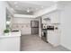 Contemporary white kitchen with stainless steel appliances and quartz countertops at 15 Bunker Pl, Rotonda West, FL 33947