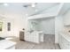 Bright, spacious kitchen with modern appliances and an island with a sink at 15 Bunker Pl, Rotonda West, FL 33947